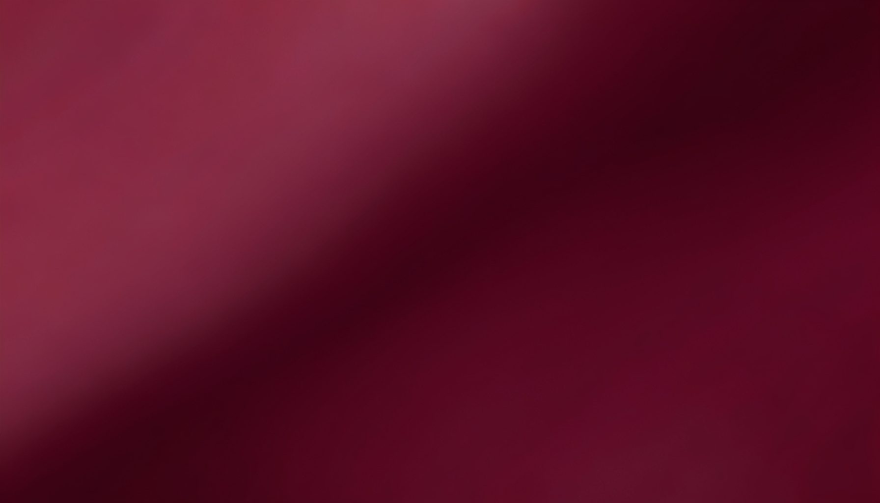 Black and dusty rose abstract gradient with gentle diagonal flow